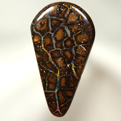 SOLID BOULDER OPAL Perfect flagstones surrounded by gem opal rivers, bright sparkles. Red, orange, green, blue.